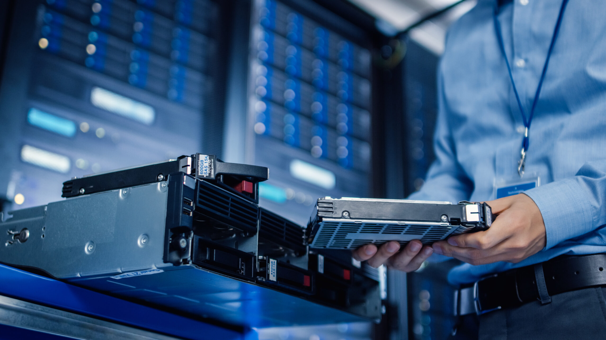 In the Modern Data Center: IT Engineer is Holding New HDD Hard D